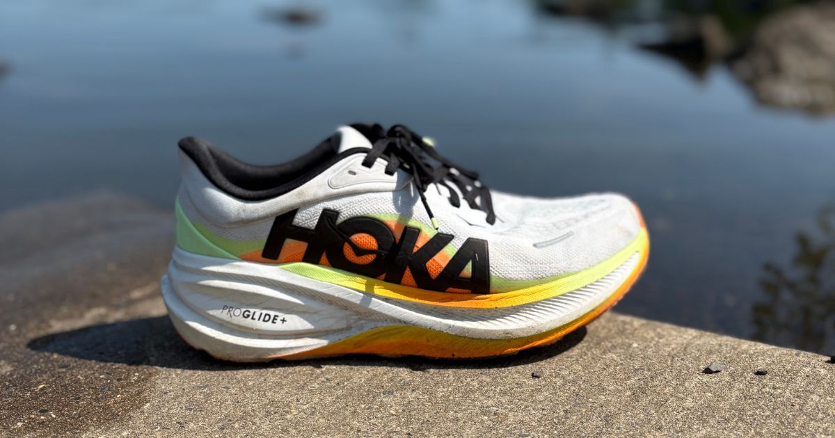 HOKA Clifton Pro side profile beside a lake