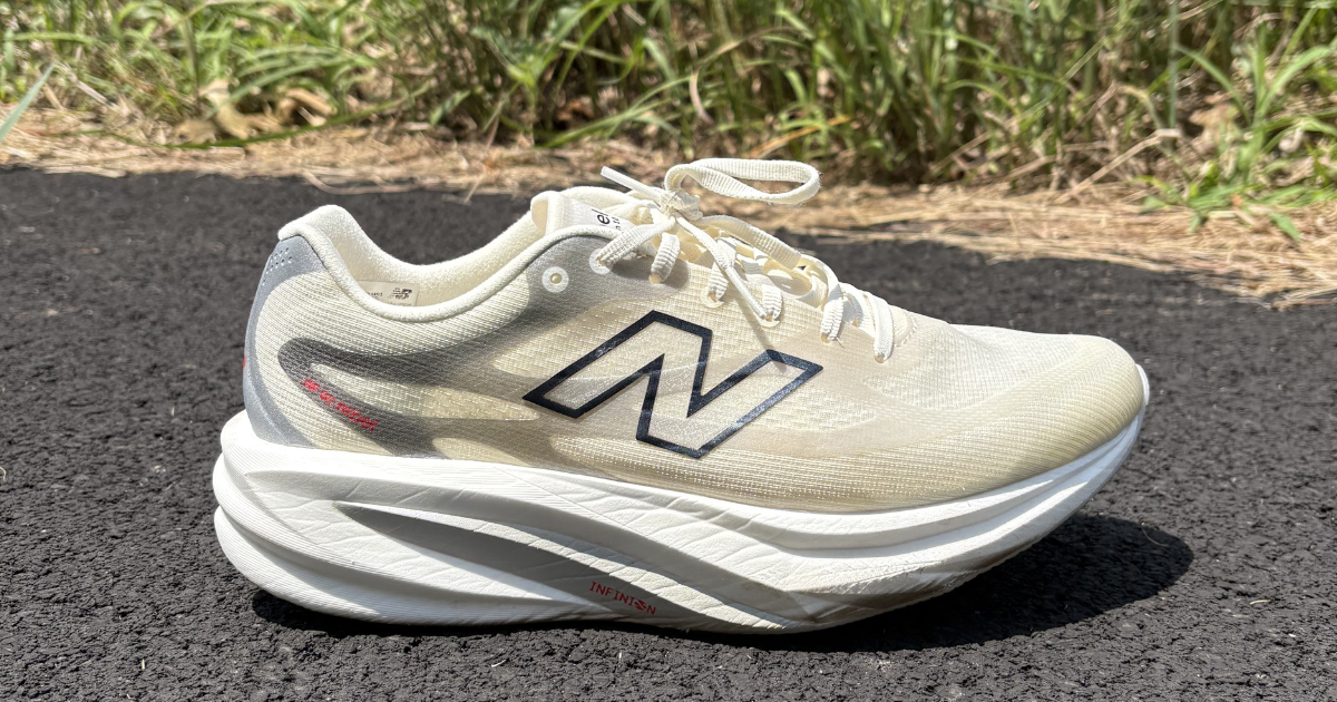 New Balance SC Rebel side profile beside grass